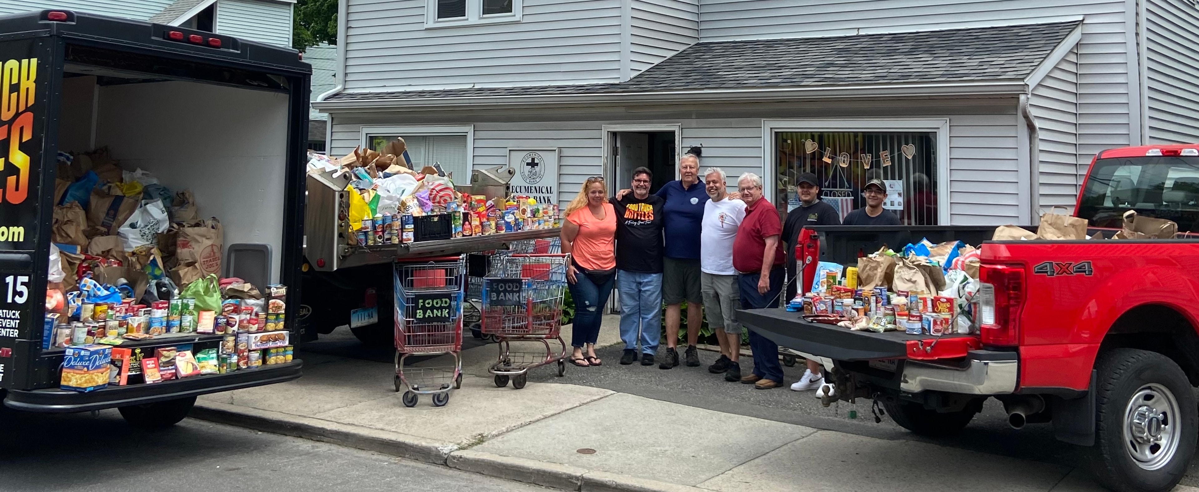 Volunteers delivering food bank donations from the CT Food Truck Battles Festival